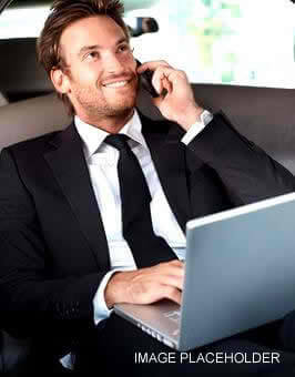 A man in a suit and tie on the phone